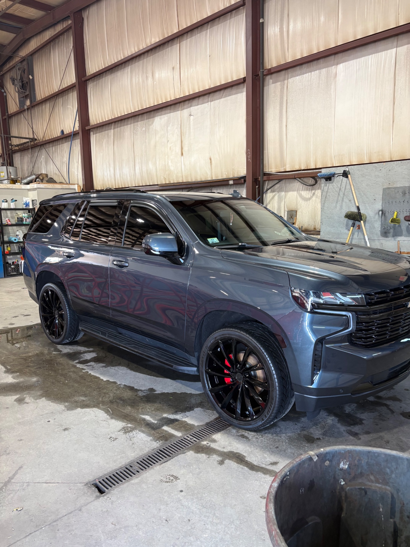 Glossy dark Chevrolet SUV after detailing