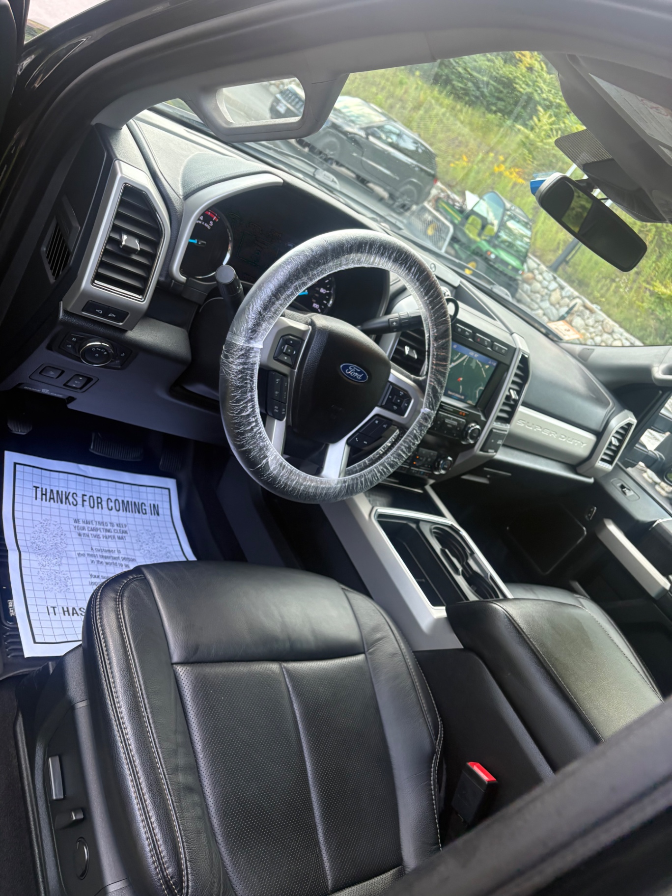 Clean black leather Ford truck interior
