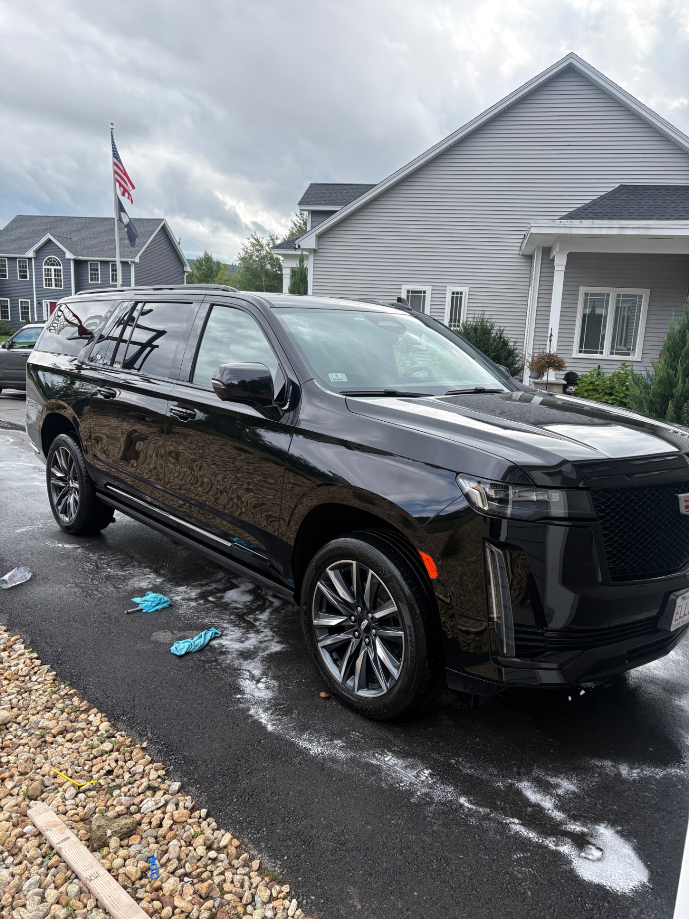 Glossy black Cadillac Escalade after an exterior detail
