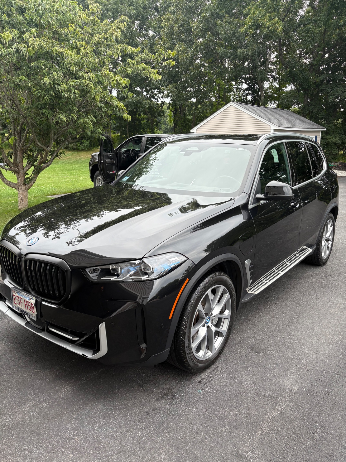 Glossy black BMW SUV after detailing