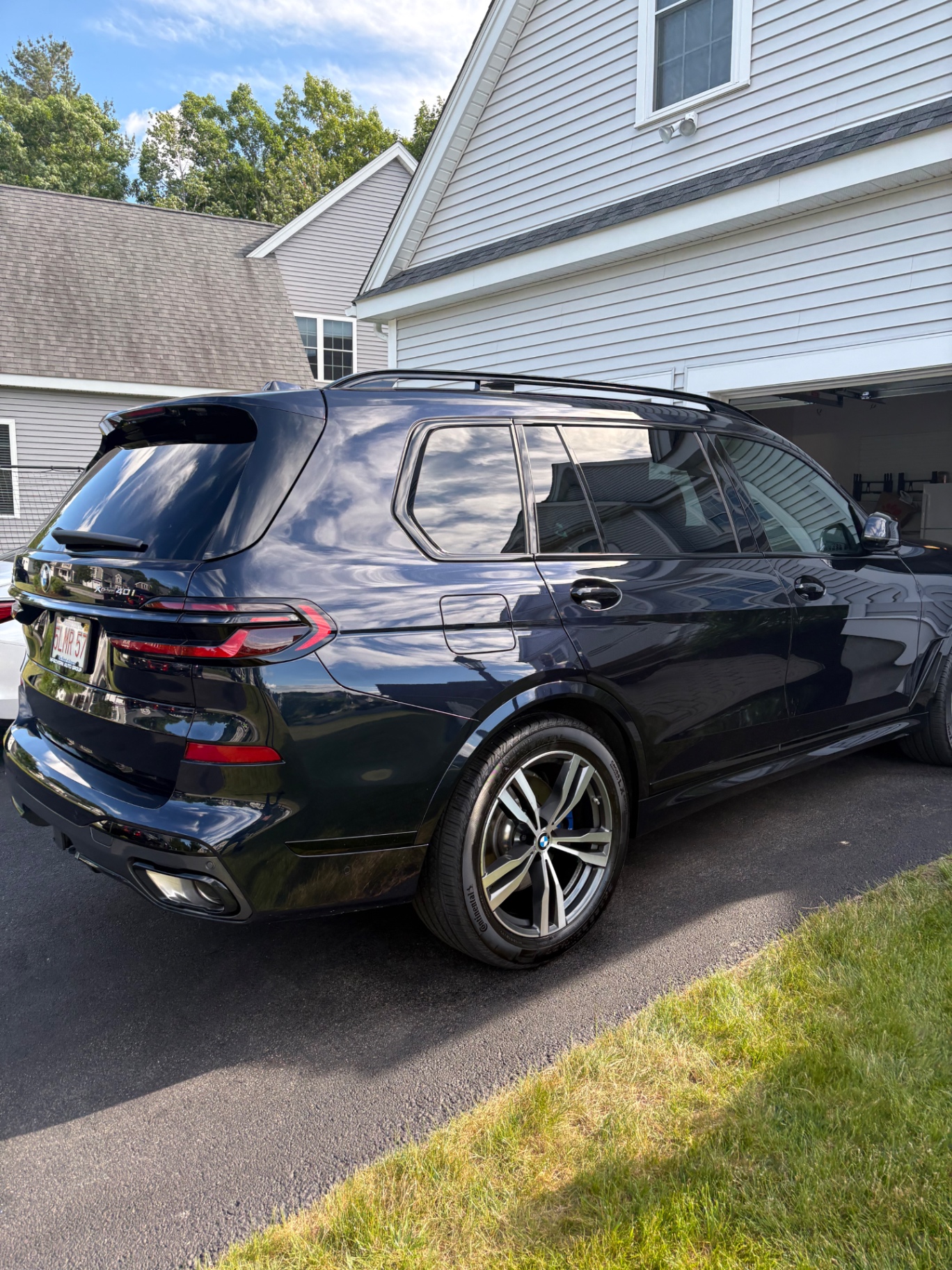 Glossy black BMW SUV after detailing